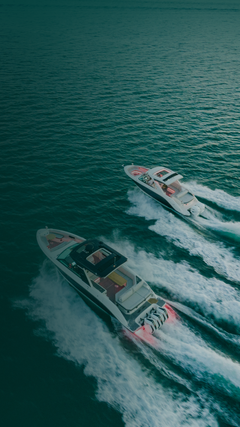 Two boats driving on the water. 